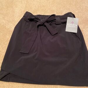 “Athleta” black skirt